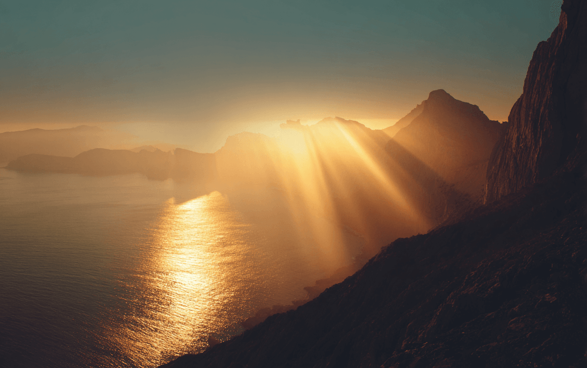 Horizon light emerging from shadow representing identity reset Horizon light emerging from shadow representing identity reset