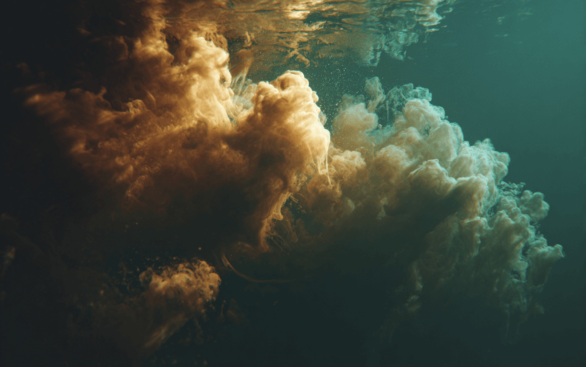 Abstract teal and gold water symbolizing emotional release through MER Abstract teal and gold water symbolizing emotional release through MER