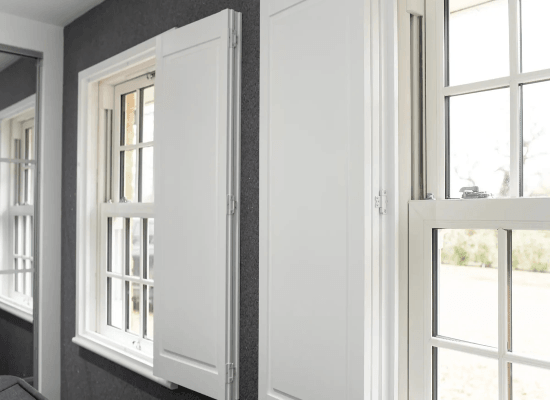 Traditional solid panel shutters for sash windows Traditional solid panel shutters for sash windows