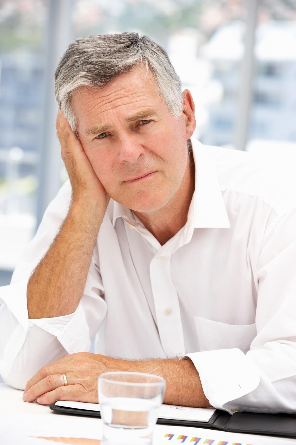Forlorn Middle Aged Man Suffering from Low Sex Drive, Hair Loss, Erectile Dysfunction, Insomnia, Depression, and Low Energy Forlorn Middle Aged Man Suffering from Low Sex Drive, Hair Loss, Erectile Dysfunction, Insomnia, Depression, and Low Energy