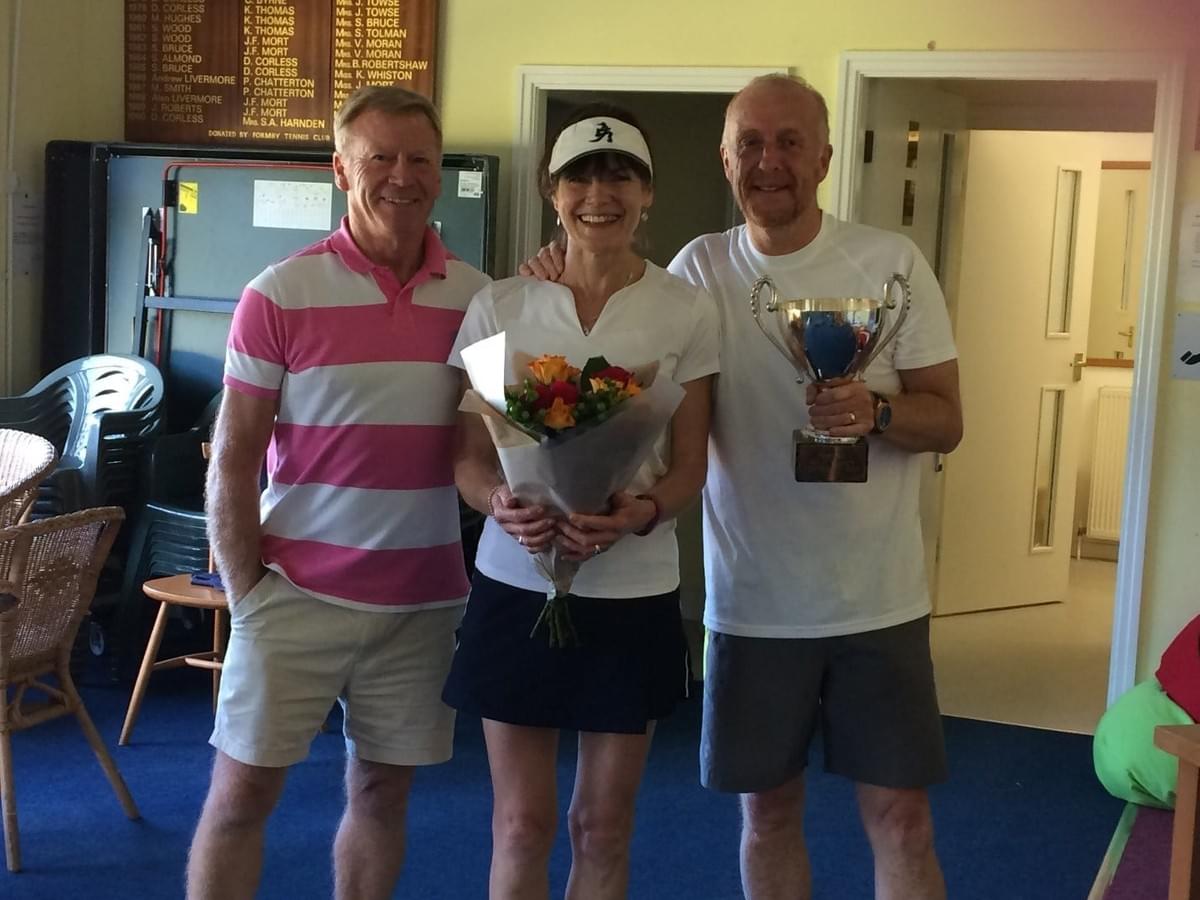 Formby Holy Trinity Tennis Club Captain John Langton, with Centenary Cup winners- Anne Girdler and Ian Davies from Southbank Tennis Club. Formby Holy Trinity Tennis Club Captain John Langton, with Centenary Cup winners- Anne Girdler and Ian Davies from Southbank Tennis Club.