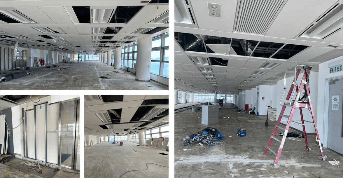 “Wide view of open-plan floor with ceiling grid panels removed and construction debris” “Close-up of ceiling grid sections and ductwork exposed above suspended ceiling” “Partially dismantled stud partition wall framing during strip-out phase” “Mid-installation view showing ceiling tiles and lighting fixtures pulled back for access” “Construction debris and cable bundles on floor next to a red step ladder under the ceiling grid” “Wide view of open-plan floor with ceiling grid panels removed and construction debris” “Close-up of ceiling grid sections and ductwork exposed above suspended ceiling” “Partially dismantled stud partition wall framing during strip-out phase” “Mid-installation view showing ceiling tiles and lighting fixtures pulled back for access” “Construction debris and cable bundles on floor next to a red step ladder under the ceiling grid”