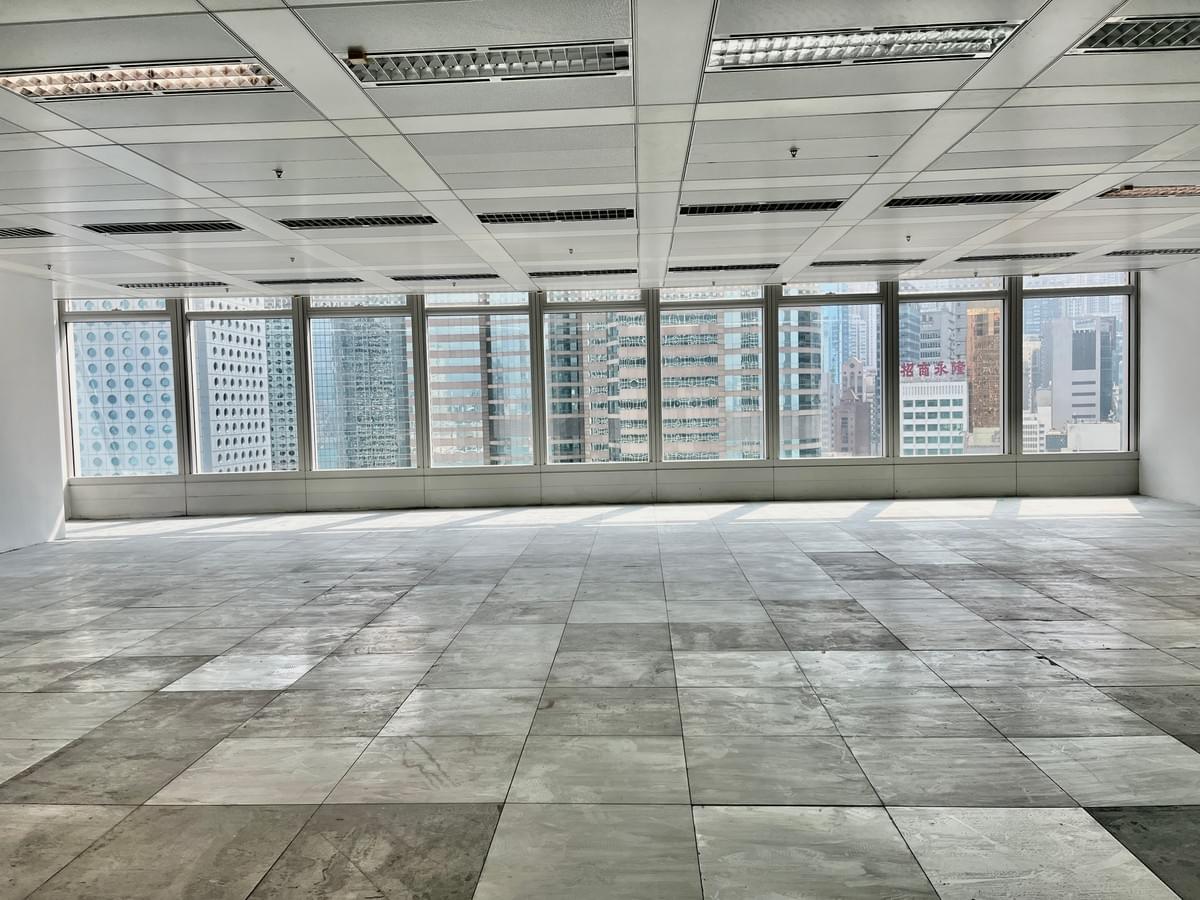Empty Hong Kong office after make-good: reinstated ceilings, patch-repaired carpet tiles and panoramic city view ready for landlord inspection Empty Hong Kong office after make-good: reinstated ceilings, patch-repaired carpet tiles and panoramic city view ready for landlord inspection