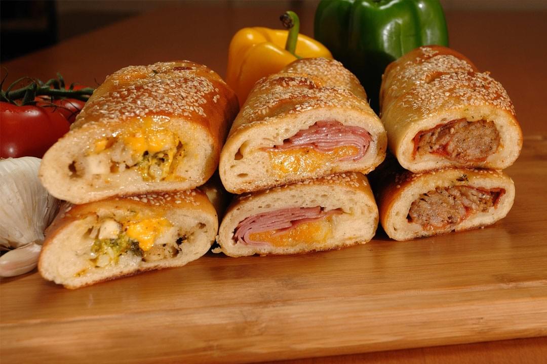 picture of sliced strombolis and fresh vegetables picture of sliced strombolis and fresh vegetables