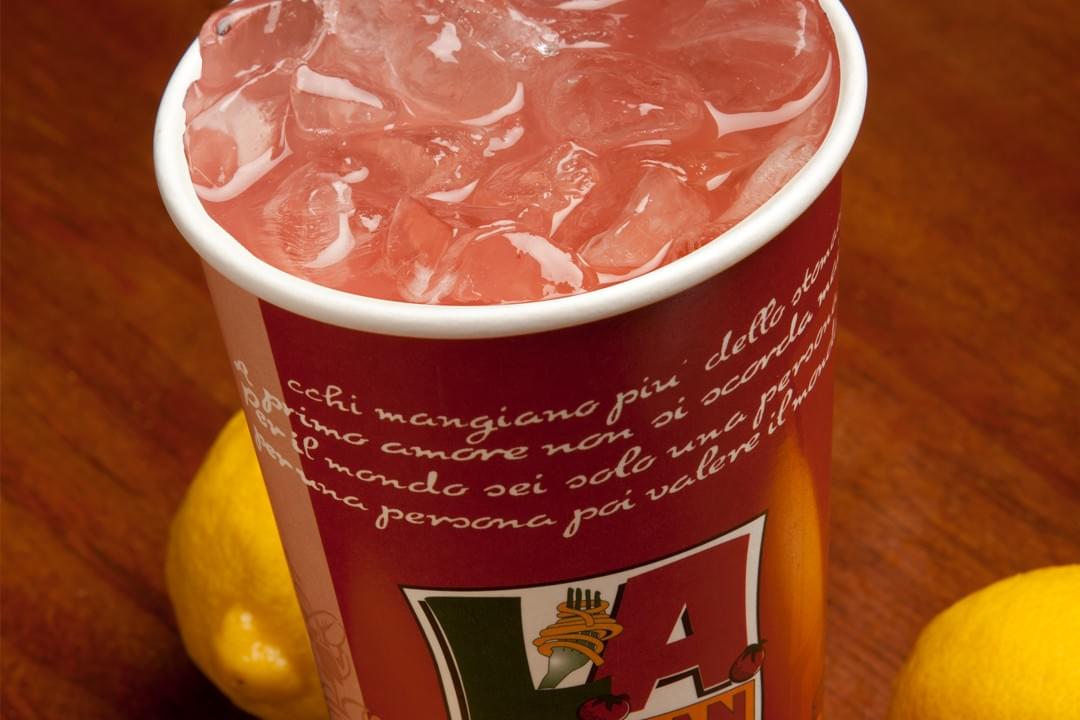 cup of pink lemonade in ice cup of pink lemonade in ice