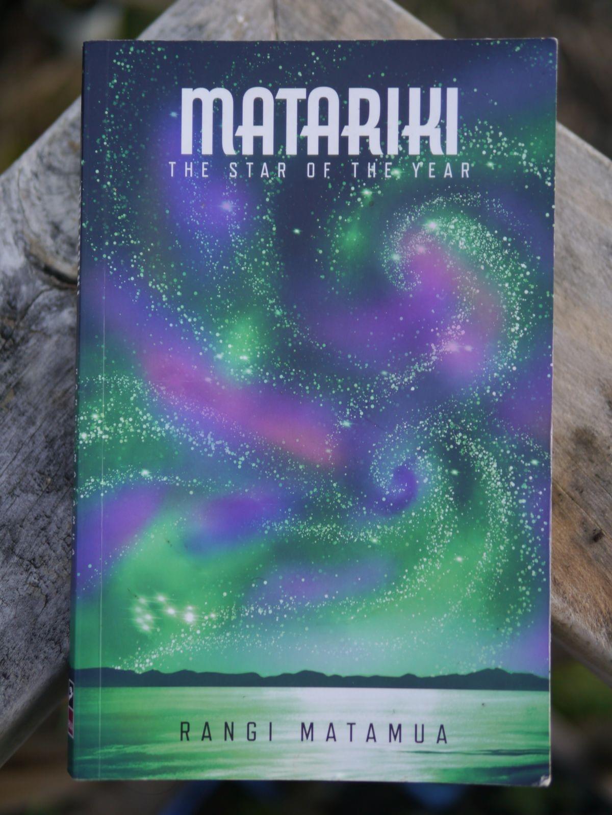 Cover of "Matariki: The Star of the Year" by Rangi Mātāmua, featuring the Matariki star cluster shining over a glowing green Aotearoa landscape. A guide to Mātauranga Māori, a celebration of renewal, rememberance, and ancestral connection. Cover of "Matariki: The Star of the Year" by Rangi Mātāmua, featuring the Matariki star cluster shining over a glowing green Aotearoa landscape. A guide to Mātauranga Māori, a celebration of renewal, rememberance, and ancestral connection.