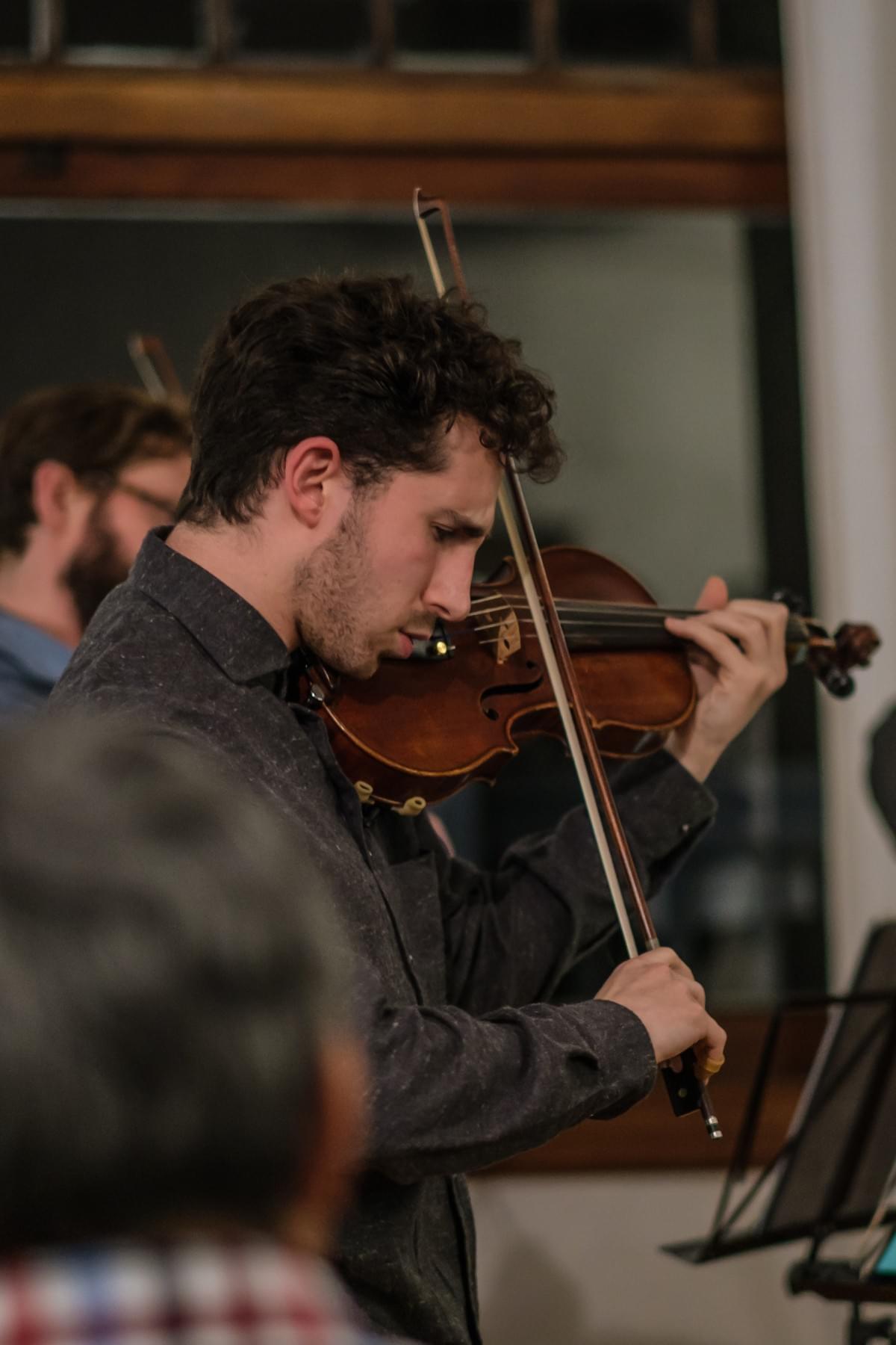 Sam Weiser performs violin with his string quartet. Sam Weiser performs violin with his string quartet.