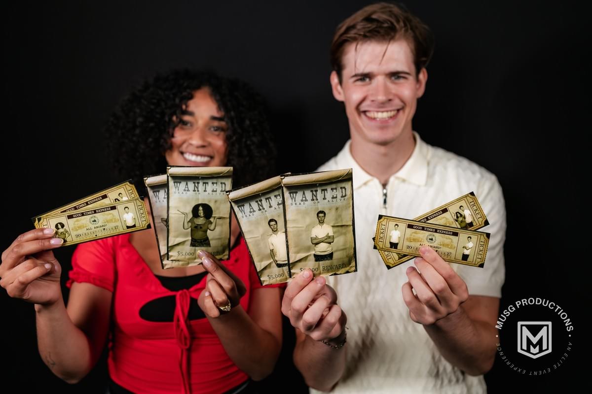 Western Wanted Experience photobooth by MUSG Productions with vintage saloon backdrop, wanted posters, and cowboy-themed party props for weddings, birthdays, and corporate events Western Wanted Experience photobooth by MUSG Productions with vintage saloon backdrop, wanted posters, and cowboy-themed party props for weddings, birthdays, and corporate events