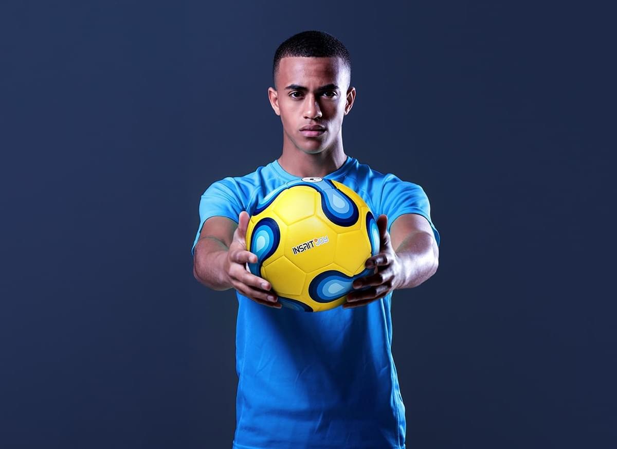 Player waking up the smart football. Player waking up the smart football.