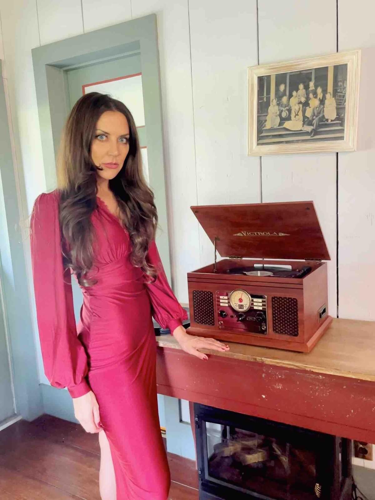 Actress Lisa Alavi wearing a wine color dress in Aged film. Actress Lisa Alavi wearing a wine color dress in Aged film.