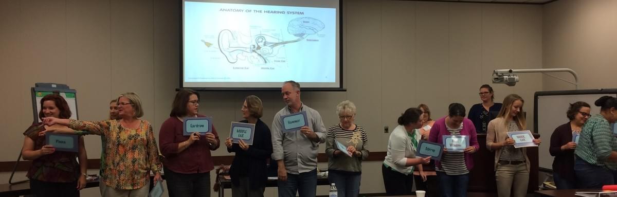 Trainees acting out the parts of the hearing system Trainees acting out the parts of the hearing system