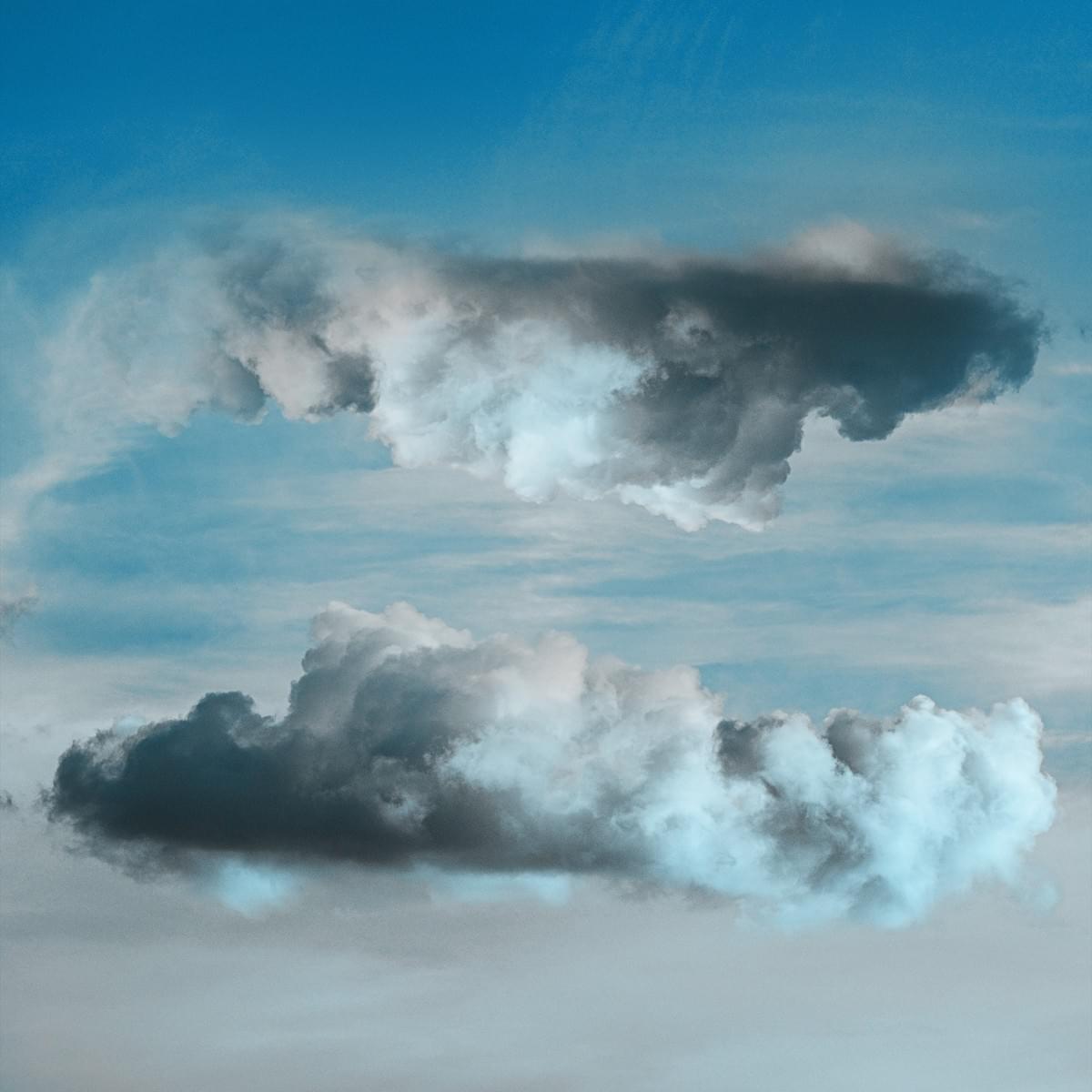 composite image of two clouds in mirrored reflection of one another composite image of two clouds in mirrored reflection of one another