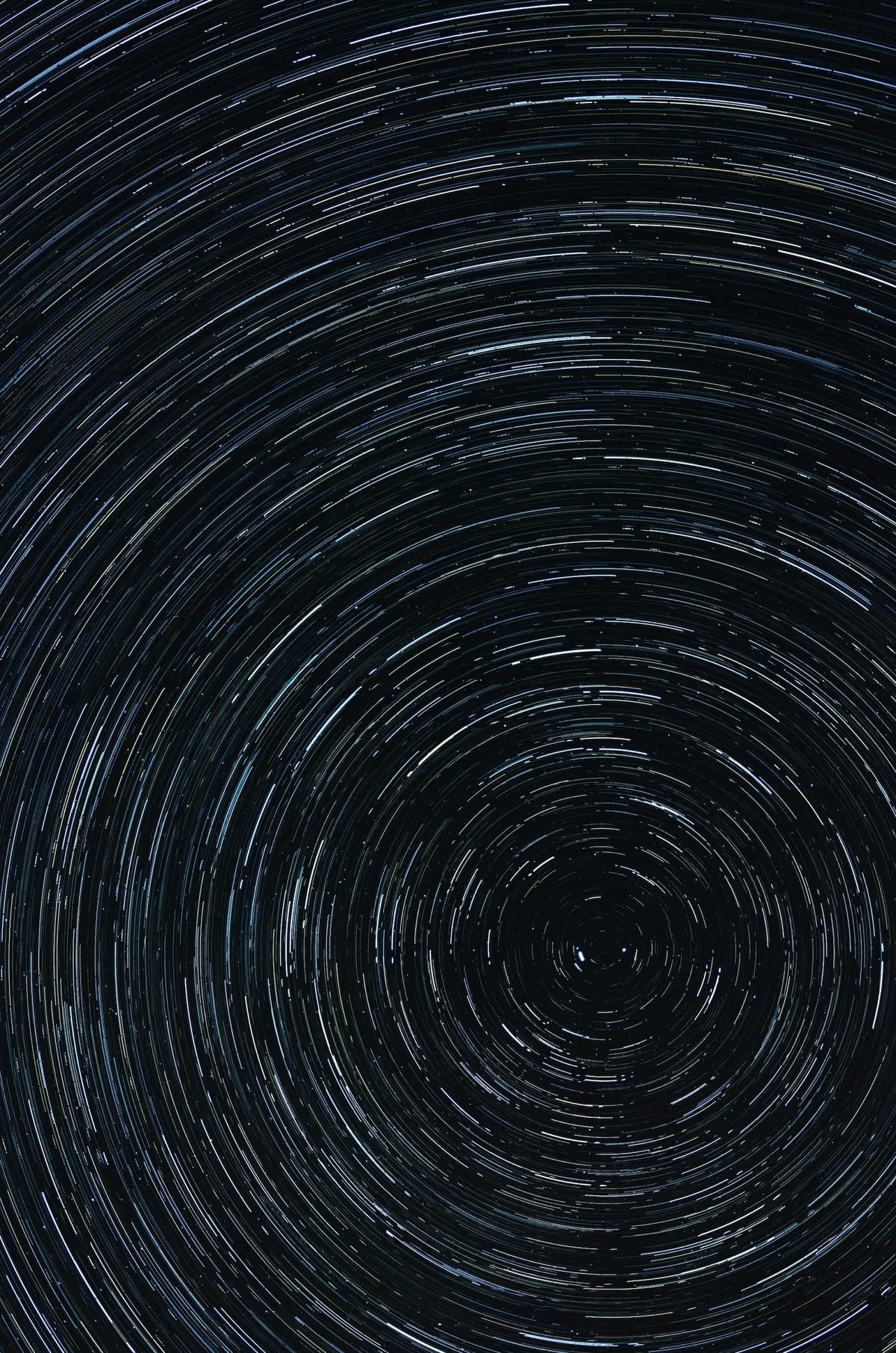 long exposure image of starry sky creating a circular pattern long exposure image of starry sky creating a circular pattern