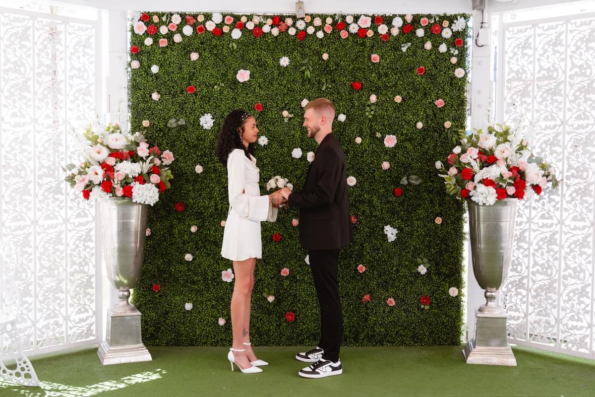 Bride and groom inside the Little White Wedding Chapel during their ceremony Bride and groom inside the Little White Wedding Chapel during their ceremony