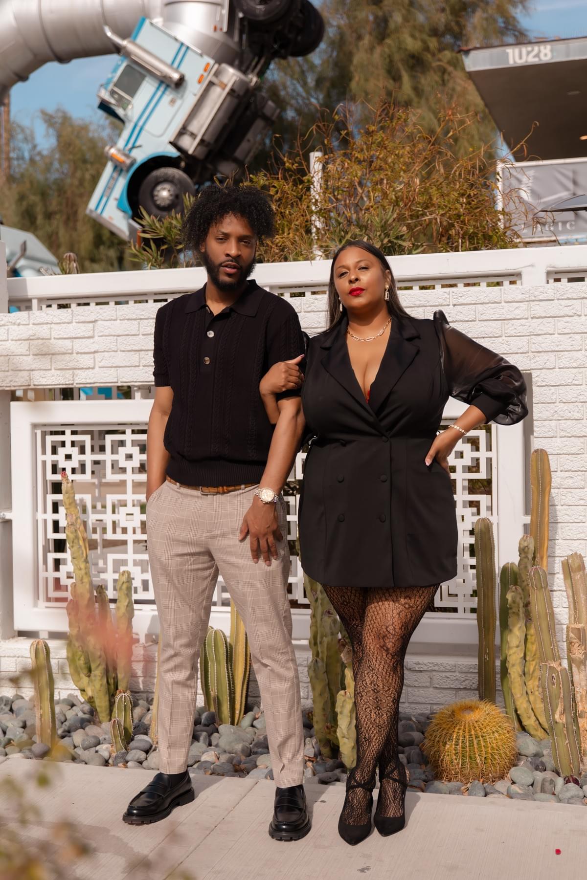 Couple posing at Fergusons in Downtown Las Vegas, a trendy Fremont Street photo spot with colorful murals and unique shops. Couple posing at Fergusons in Downtown Las Vegas, a trendy Fremont Street photo spot with colorful murals and unique shops.