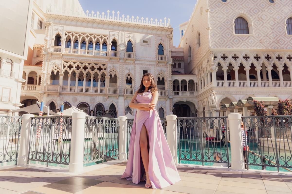 Woman standing in front of the Venetian hotel in Las Vegas, highlighting the hotel’s elegant architecture and romantic photo setting. Woman standing in front of the Venetian hotel in Las Vegas, highlighting the hotel’s elegant architecture and romantic photo setting.