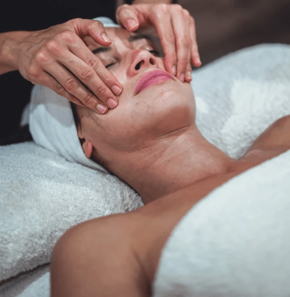 Client receiving a facial massage Client receiving a facial massage