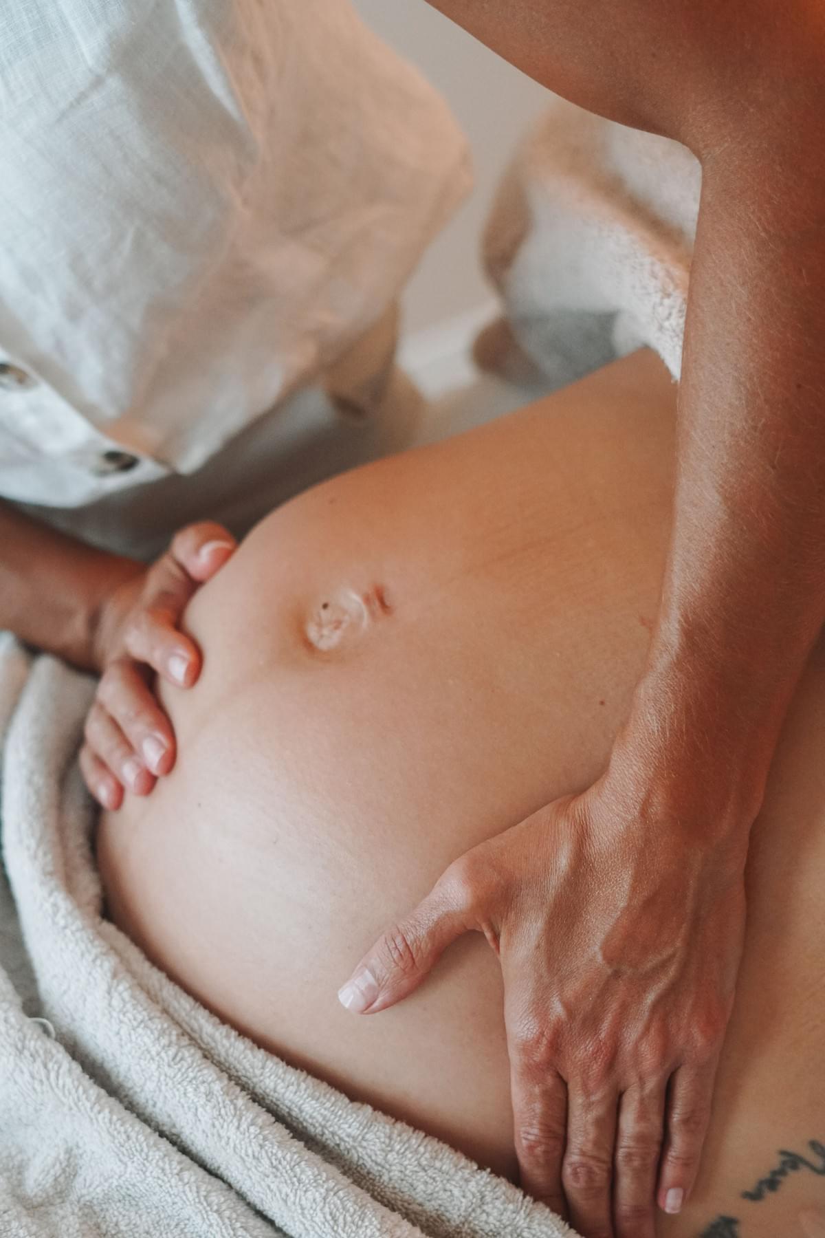 Pregnant woman receiving a massage Pregnant woman receiving a massage