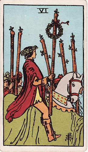 A person rides victoriously astride a horse holding a staff bedecked with a laurel wreath as people walk beside them. A person rides victoriously astride a horse holding a staff bedecked with a laurel wreath as people walk beside them.