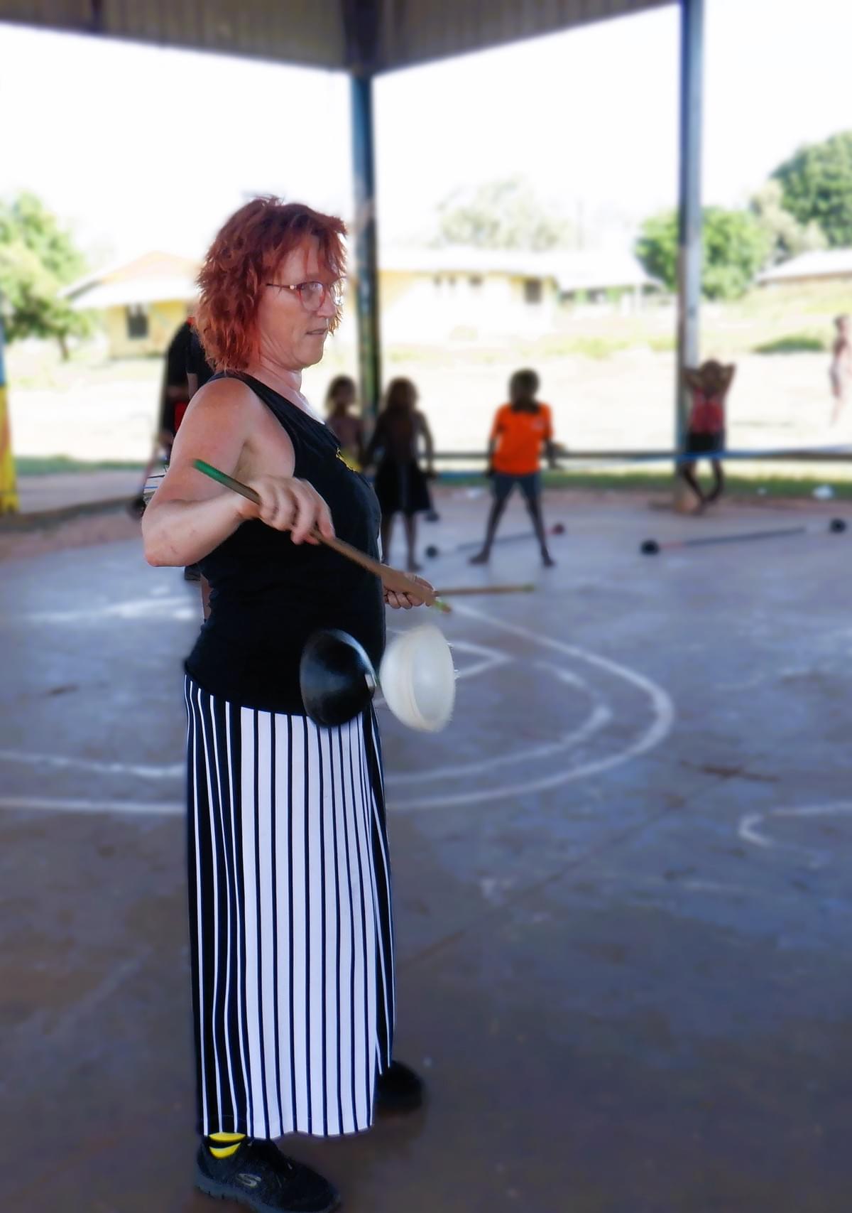 Nikki sharing diabolo in a community setting Nikki sharing diabolo in a community setting