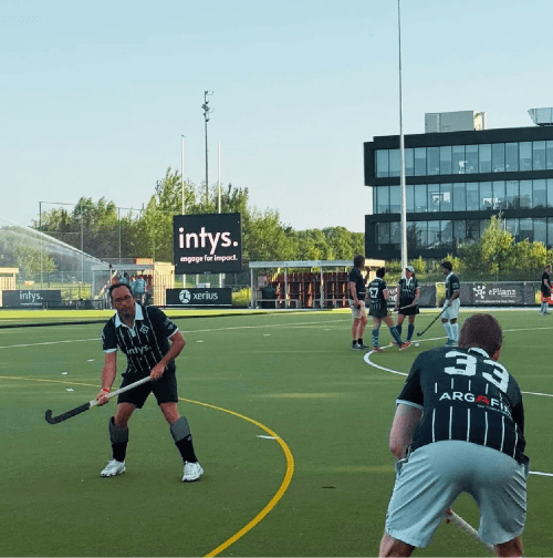 Intys consultants playing hockey during an Intys-branded Super Sunday at Louvain-la-Neuve Hockey Club Intys consultants playing hockey during an Intys-branded Super Sunday at Louvain-la-Neuve Hockey Club