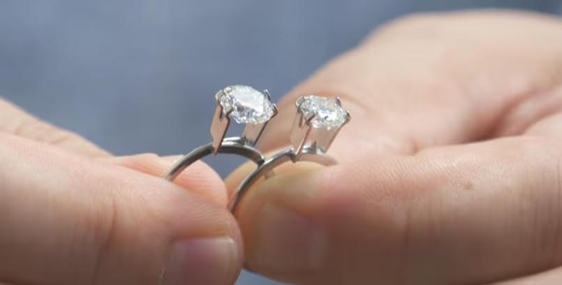 Aret Oymakas, owner of Livia Diamonds, holds two diamonds — the one on the left is lab grown, and the one on the right is mined. Without special tools, you can't tell which one was mined and which is man-made, says Oymakas. Aret Oymakas, owner of Livia Diamonds, holds two diamonds — the one on the left is lab grown, and the one on the right is mined. Without special tools, you can't tell which one was mined and which is man-made, says Oymakas.