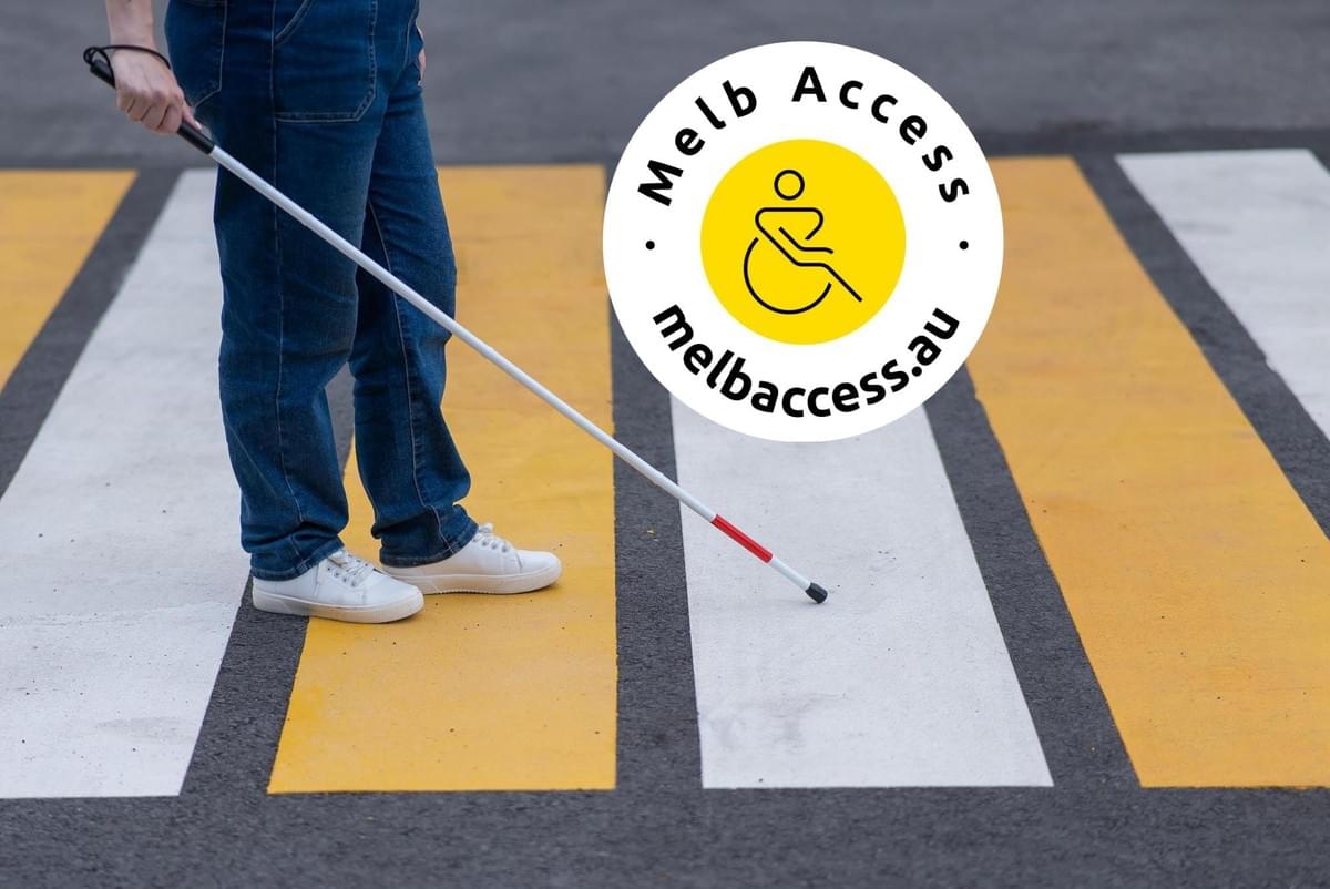 Close-up of the legs of a blind woman crossing the road at a crosswalk with a cane with logo Close-up of the legs of a blind woman crossing the road at a crosswalk with a cane with logo