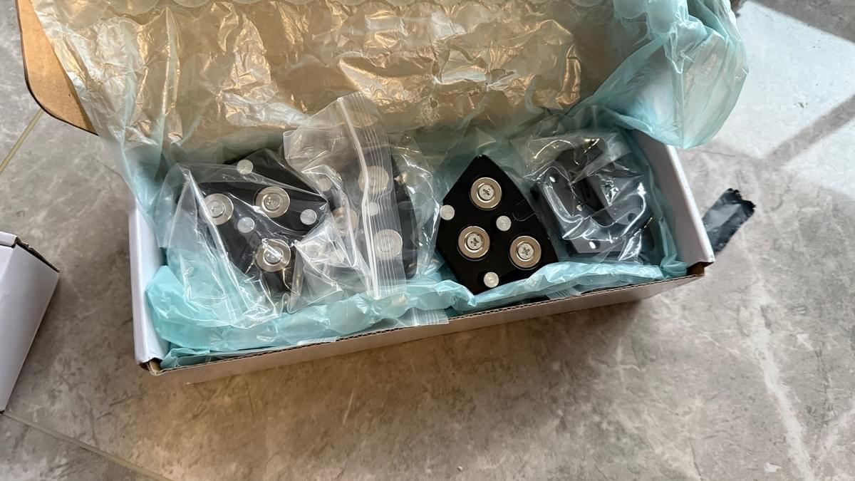Monkey King magnetic adapters packed in protective bags and a tissue-lined shipping box Monkey King magnetic adapters packed in protective bags and a tissue-lined shipping box
