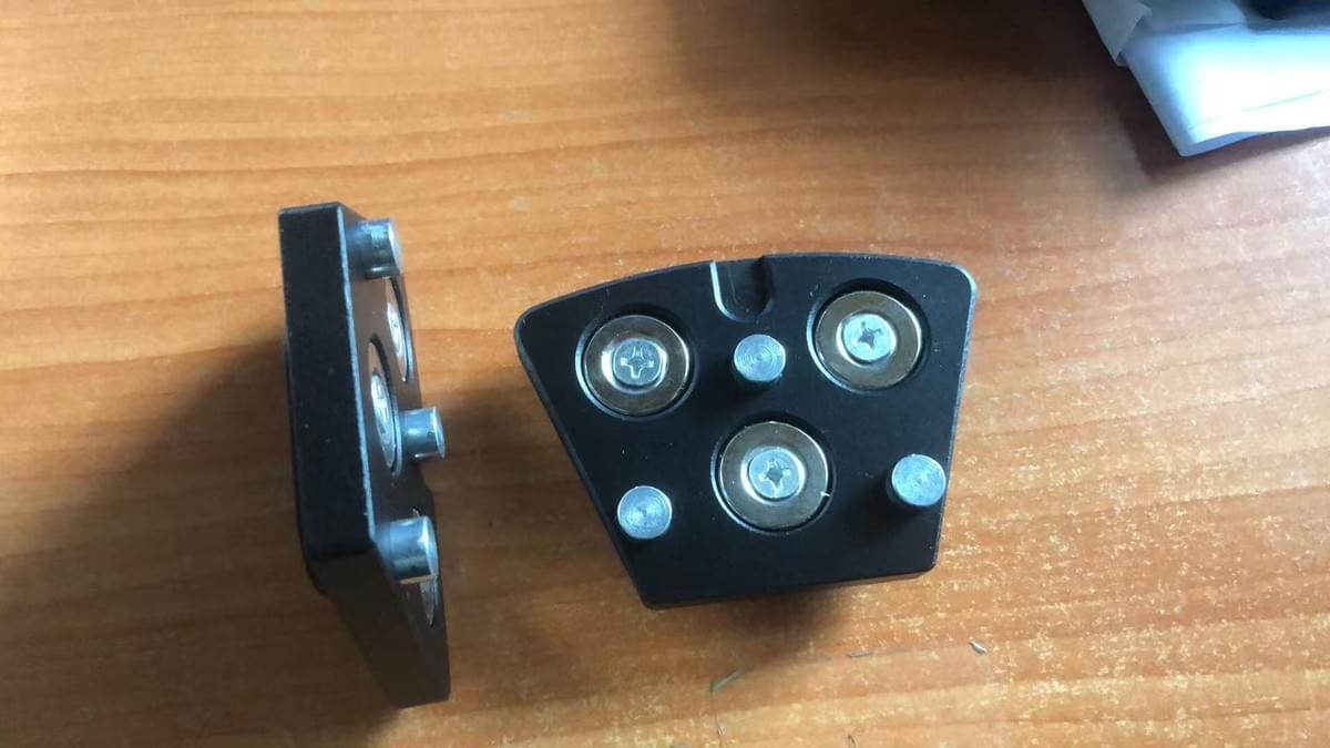 Black magnetic adapter plates with three circular magnets for a Rhino RS150 trapezoid tooling conversion setup Black magnetic adapter plates with three circular magnets for a Rhino RS150 trapezoid tooling conversion setup