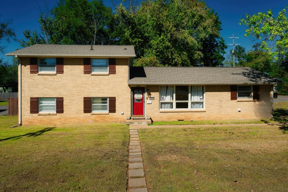 Brick split-level home on a large corner lot with green lawn and walkway at 1002 W Northfield Blvd Forest Hills Estates Murfreesboro TN Brick split-level home on a large corner lot with green lawn and walkway at 1002 W Northfield Blvd Forest Hills Estates Murfreesboro TN