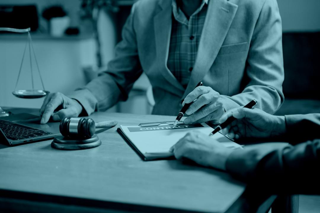 Lawyer presenting estate and financial documents in a professional setting Lawyer presenting estate and financial documents in a professional setting