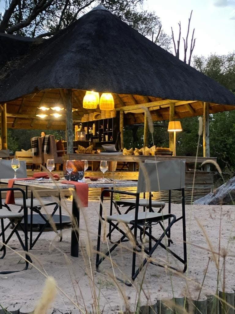 Comfortable camp chairs arranged around a fire pit in a beautifully set up luxury camp offering a relaxing atmosphere. Comfortable camp chairs arranged around a fire pit in a beautifully set up luxury camp offering a relaxing atmosphere.