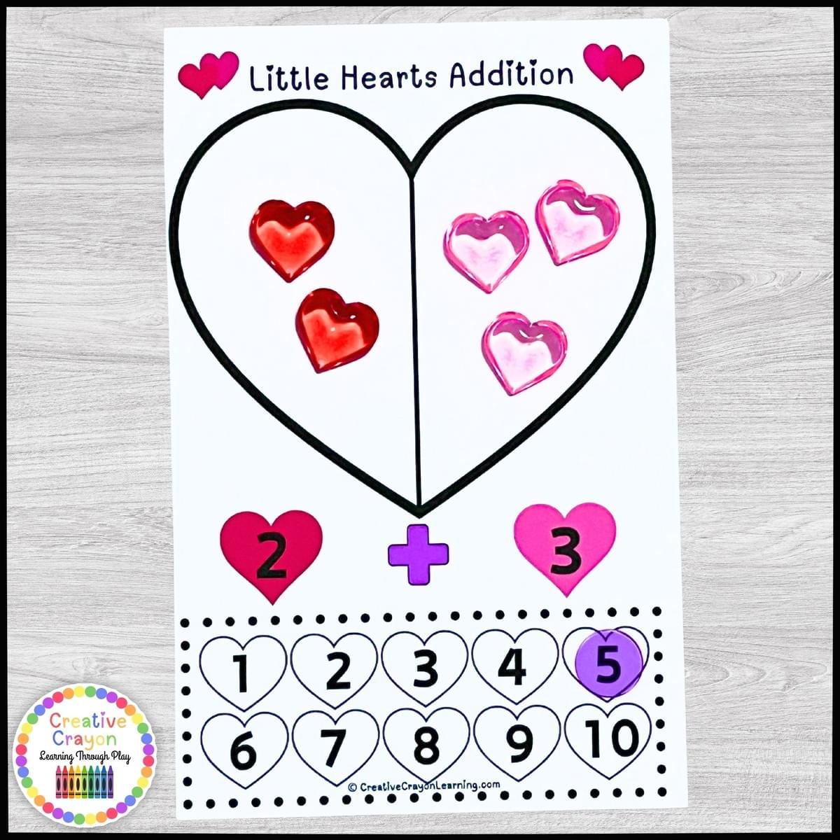 Valentine’s Day addition center for kindergarten using red and pink heart manipulatives to solve math problems. Valentine’s Day addition center for kindergarten using red and pink heart manipulatives to solve math problems.