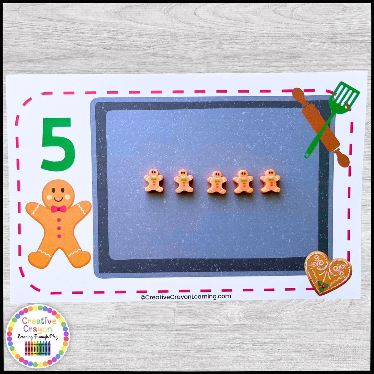 Kindergarten students engaging in a gingerbread counting activity, matching cookies to numbered pans Kindergarten students engaging in a gingerbread counting activity, matching cookies to numbered pans
