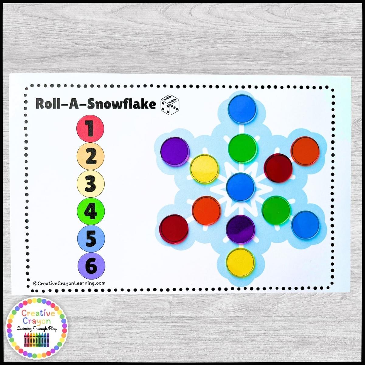 Kindergarten snowflake roll-and-cover winter math game using dice and bingo chips Kindergarten snowflake roll-and-cover winter math game using dice and bingo chips