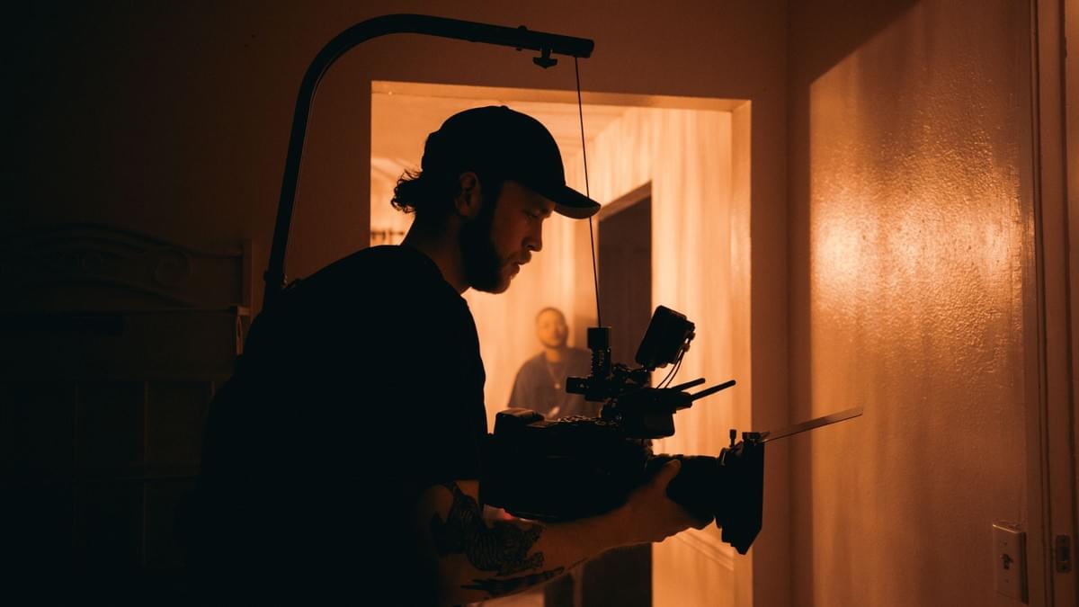 Film Distribution, man holding camera Film Distribution, man holding camera
