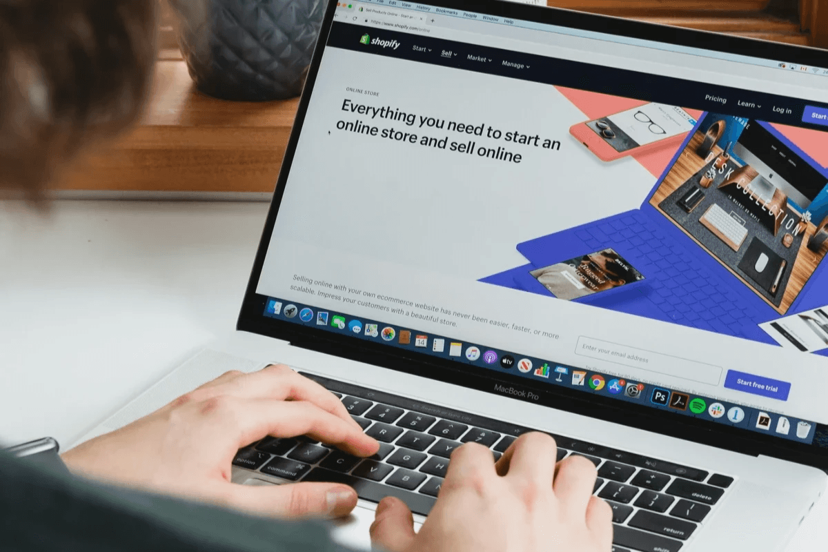 Person using a laptop for online commerce Person using a laptop for online commerce