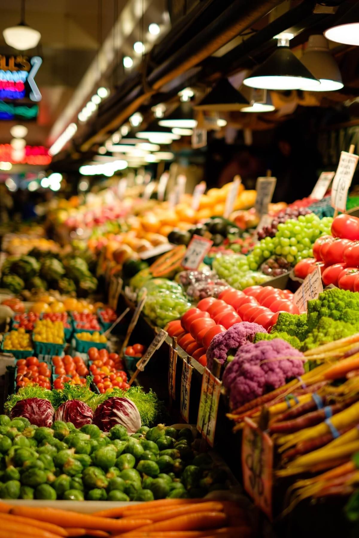 A photo of a vegetable and fruit market with brightly colored fresh produce, as featured in the blog post "Tips for Plant-Based-Diet Veterans" on The Purple Dog Blog by The Purple Dog Vegan A photo of a vegetable and fruit market with brightly colored fresh produce, as featured in the blog post "Tips for Plant-Based-Diet Veterans" on The Purple Dog Blog by The Purple Dog Vegan