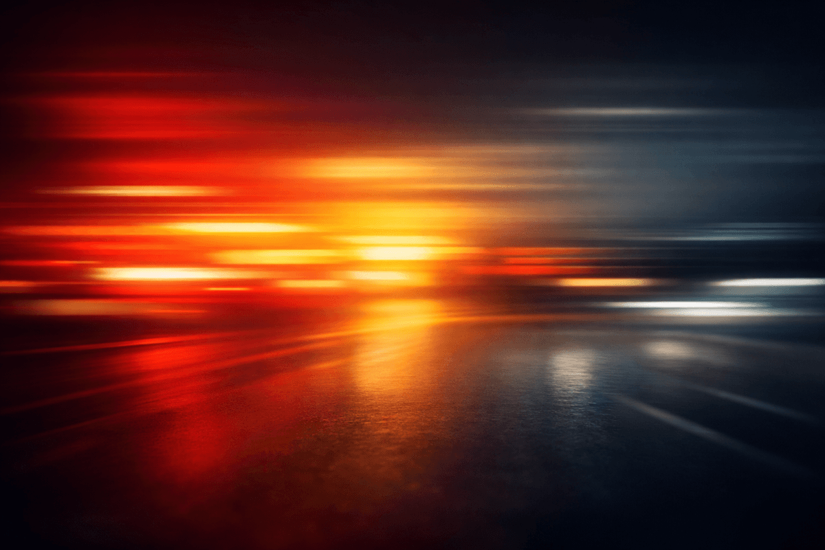 A blurred, streaked gradient that looks like tail‑lights and brake‑lights smeared in motion. Colours deep reds → amber → charcoal. A blurred, streaked gradient that looks like tail‑lights and brake‑lights smeared in motion. Colours deep reds → amber → charcoal.