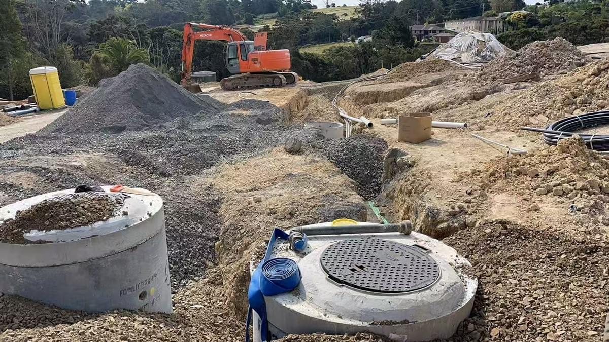 Public stormwater and wastewater infrastructure works for a 9-lot residential subdivision on Ti Rakau Drive, Pakuranga. The project was located on a busy arterial road and required extensive traffic management and three weeks of night works from 9pm to 5am. The works included approximately 25m each of stormwater and wastewater pipeline installed by full open-cut excavation along the footpath. Night-time visibility and working within a live traffic environment added significant construction challenges. Public stormwater and wastewater infrastructure works for a 9-lot residential subdivision on Ti Rakau Drive, Pakuranga. The project was located on a busy arterial road and required extensive traffic management and three weeks of night works from 9pm to 5am. The works included approximately 25m each of stormwater and wastewater pipeline installed by full open-cut excavation along the footpath. Night-time visibility and working within a live traffic environment added significant construction challenges.