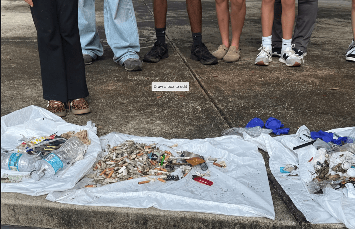 Photo of tobacco litter collected at local park clean-up event with SWAT youth feet in the background Photo of tobacco litter collected at local park clean-up event with SWAT youth feet in the background