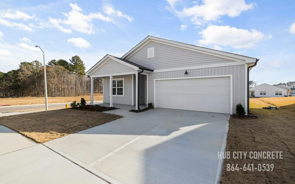 just finished short new driveway to home with two car garage in residential development just finished short new driveway to home with two car garage in residential development