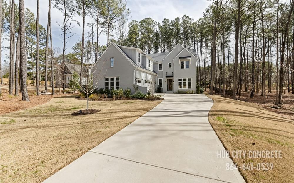 new concrete driveway to large home in winter new concrete driveway to large home in winter