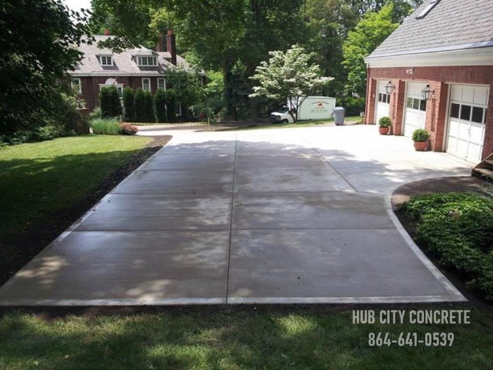 new concrete driveway and parking pad project with curved pad turnaround and three car garage new concrete driveway and parking pad project with curved pad turnaround and three car garage