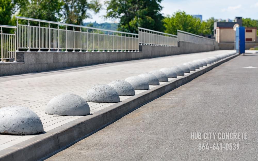 stamped concrete public sidewalk with concrete dome barriers stamped concrete public sidewalk with concrete dome barriers