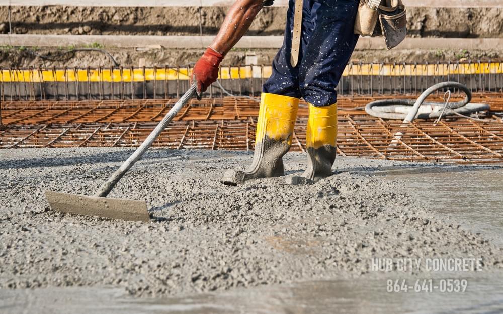 spreading wet concrete over large reinforced slab spreading wet concrete over large reinforced slab