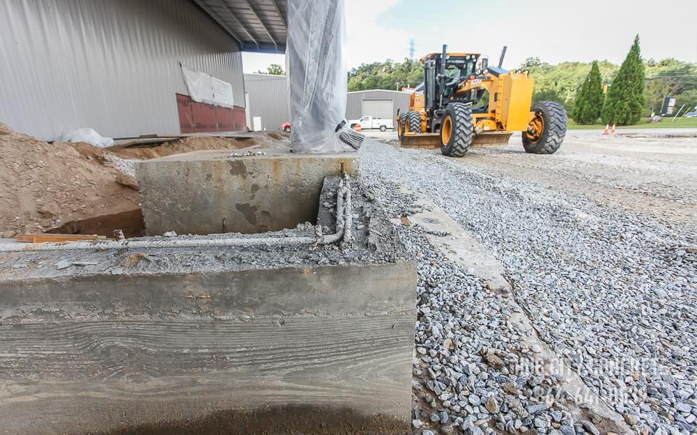 concrete loading dock foundation construction at new warehouse with motor grader concrete loading dock foundation construction at new warehouse with motor grader