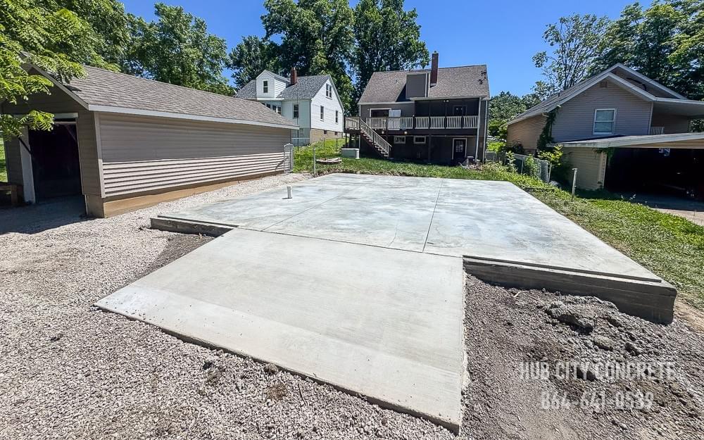 just completed concrete slab with ramp for residential outbuilding garage just completed concrete slab with ramp for residential outbuilding garage