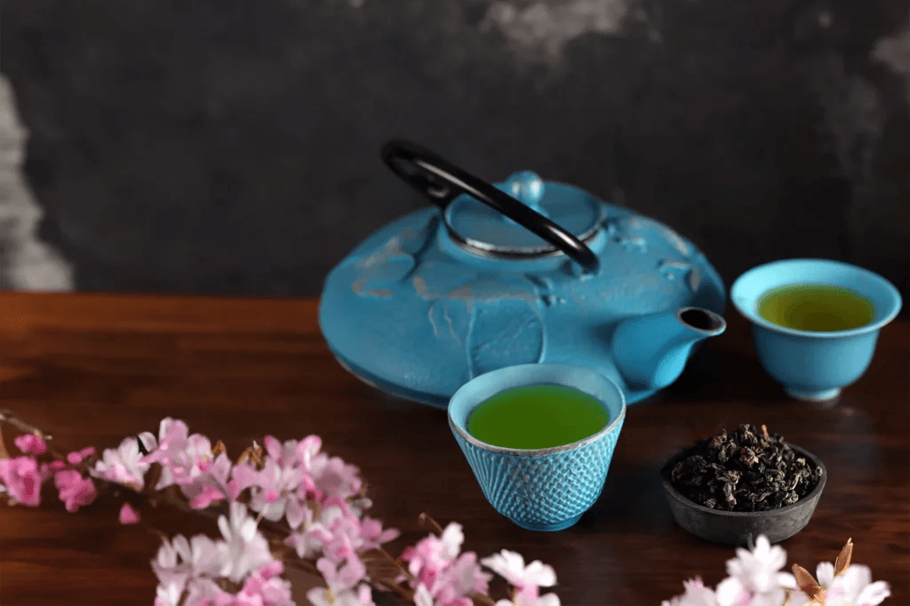 Brewed gyokuro green tea served in a traditional Japanese teapot and cups. Brewed gyokuro green tea served in a traditional Japanese teapot and cups.