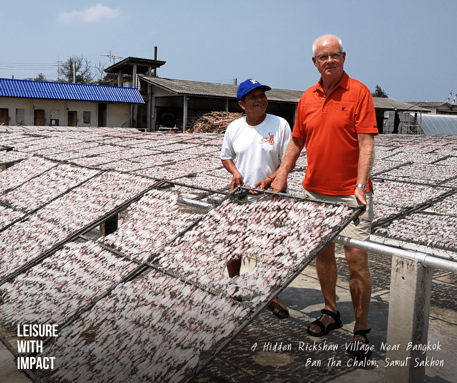 Local rickshaw guide sharing village stories in Ban Thachalom near Bangkok Local rickshaw guide sharing village stories in Ban Thachalom near Bangkok